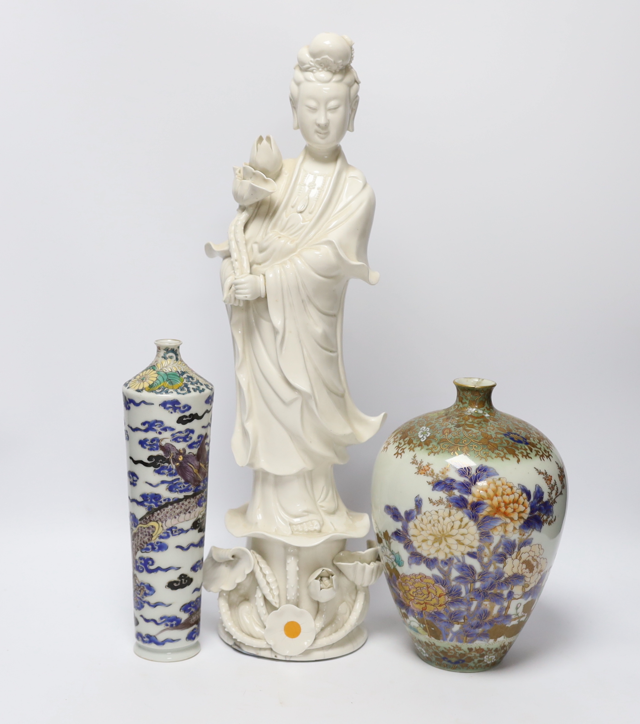 A 19th century Chinese blanc de chine figure of Guanyin, 20th century ‘dragon’ vase and a Japanese Meiji period vase, by Fukagawa, koransha mark, tallest 46.5cm